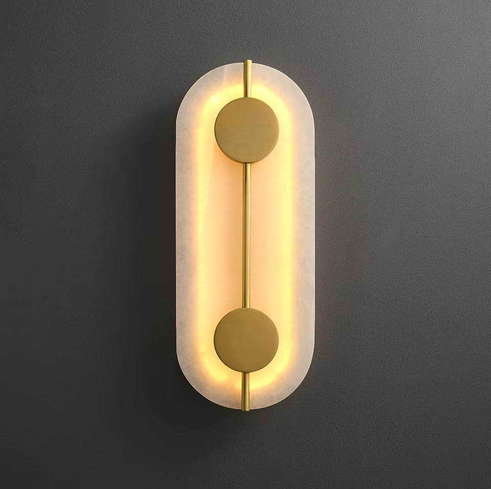 Front view of oval wall light illuminated with warm glow
